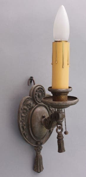 Antique wall sconce with candle light.