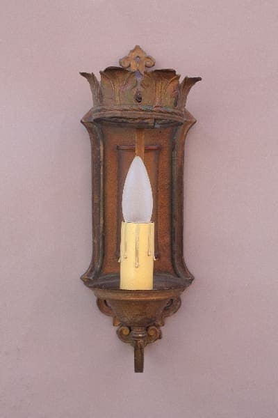 Vintage wall sconce with candle-like light.