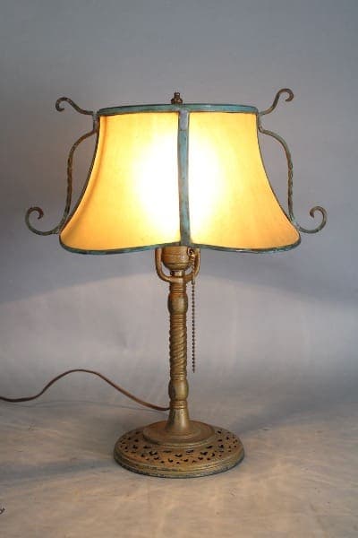 Vintage table lamp with yellow lampshade.