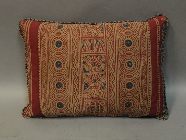 Decorative pillow with intricate geometric patterns.