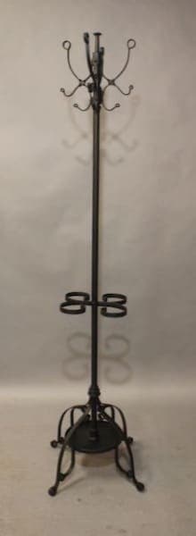 Black metal coat rack with hooks.