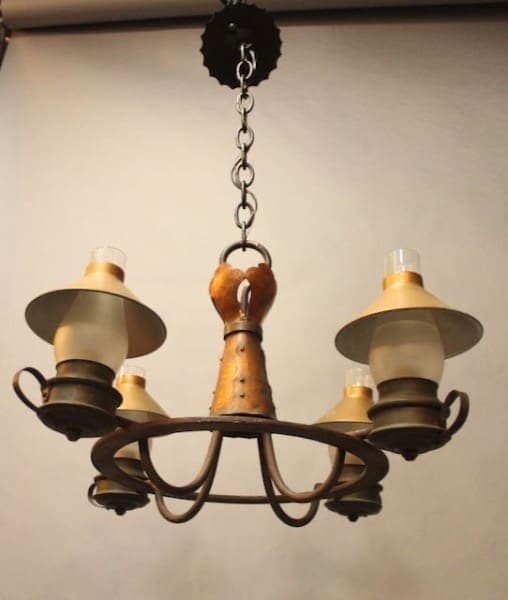 Vintage four-light metal chandelier with lampshades.