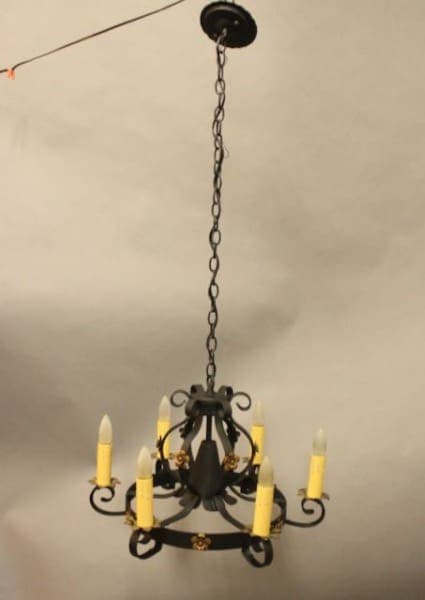 Black chandelier with candle-shaped lights.