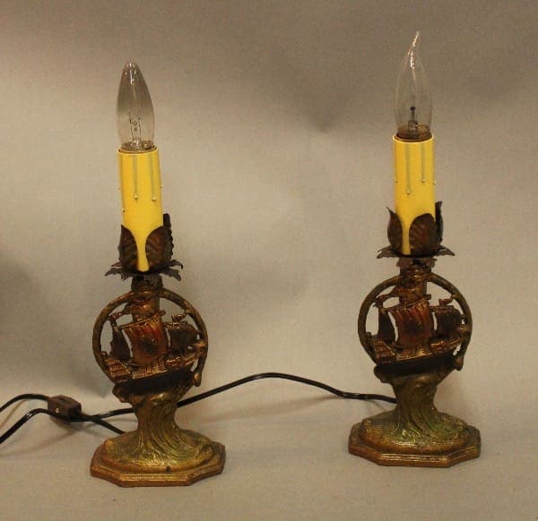 Vintage lamps with ornate bases and bulbs.