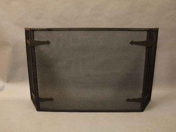 Metal mesh fireplace screen with frame.
