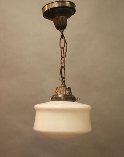 Vintage hanging light with white glass shade.