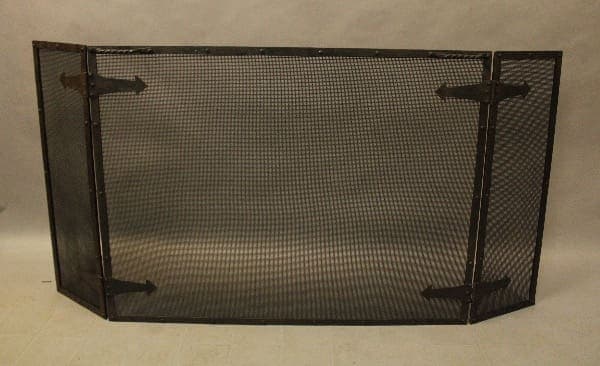 Black metal mesh fireplace screen with hinges.