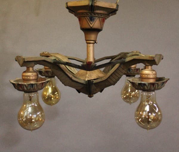 Vintage chandelier with exposed light bulbs.
