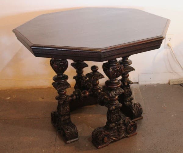 Ornate wooden table with carved legs.