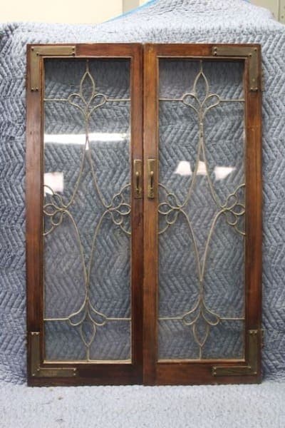 Wooden door with decorative glass panels.