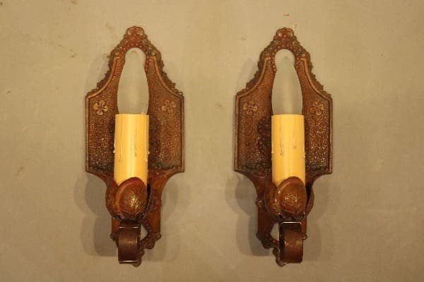 Vintage decorative wall sconces with candles.