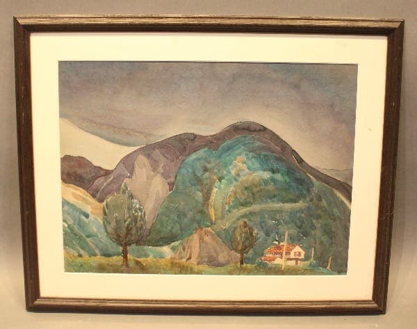 Framed painting of mountains and trees.