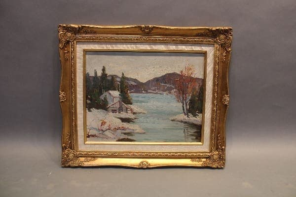 Framed landscape painting with river and trees.
