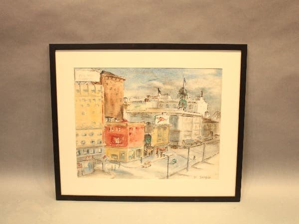 Framed cityscape watercolor painting on wall.