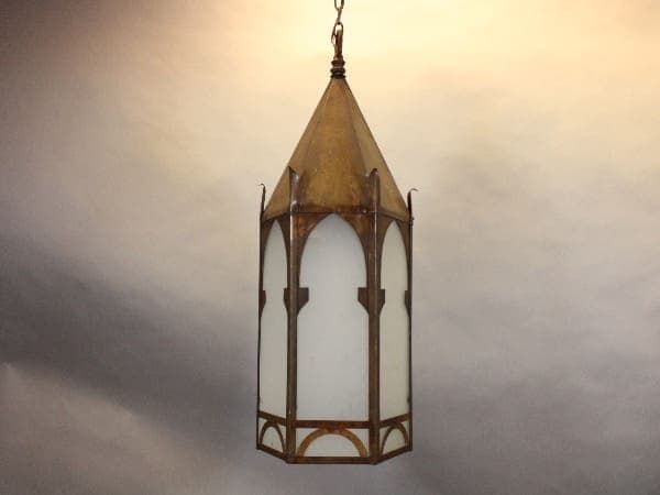 Vintage hanging lantern with metal frame.