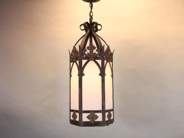 Gothic-style hanging lantern with soft glow.