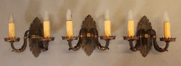 Vintage wall sconces with candle-shaped bulbs.