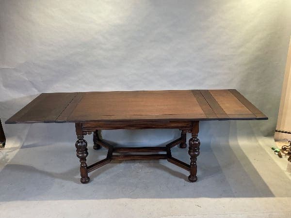 Antique wooden dining table with extensions.