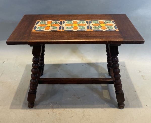 Wooden table with colorful tile inlay.