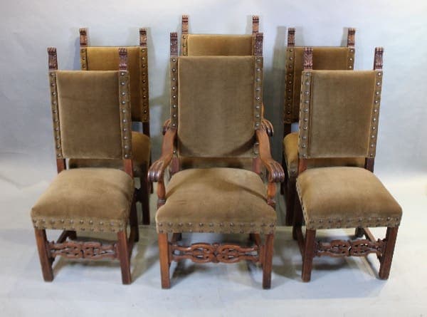 Eight brown upholstered chairs in a row.