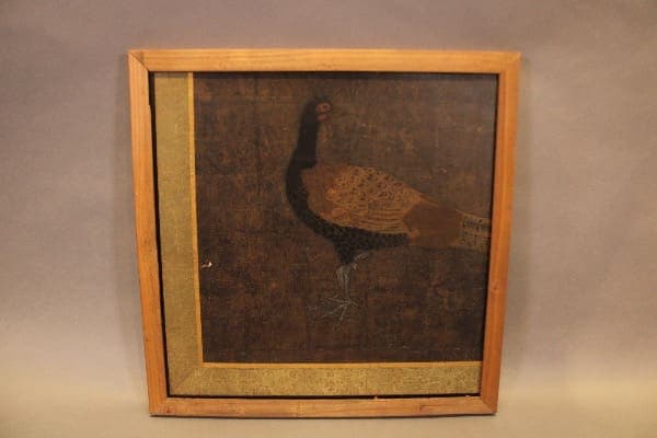 Framed painting of a bird on canvas.
