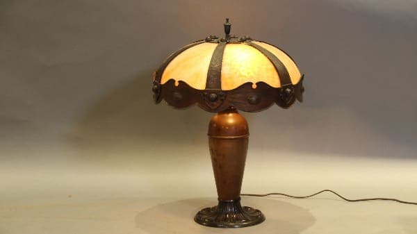 Vintage table lamp with ornate stained glass.