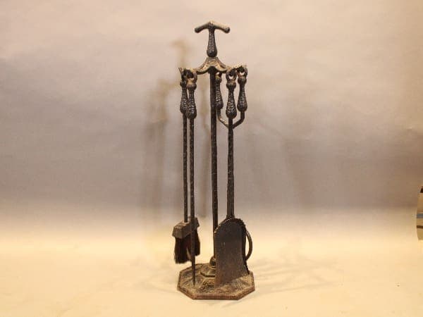 Antique fireplace tool set with stand.