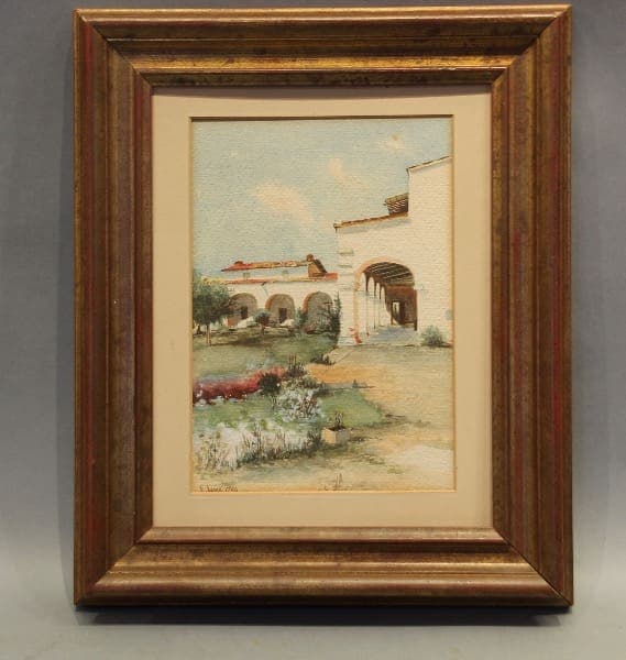 Framed painting of a building and landscape.