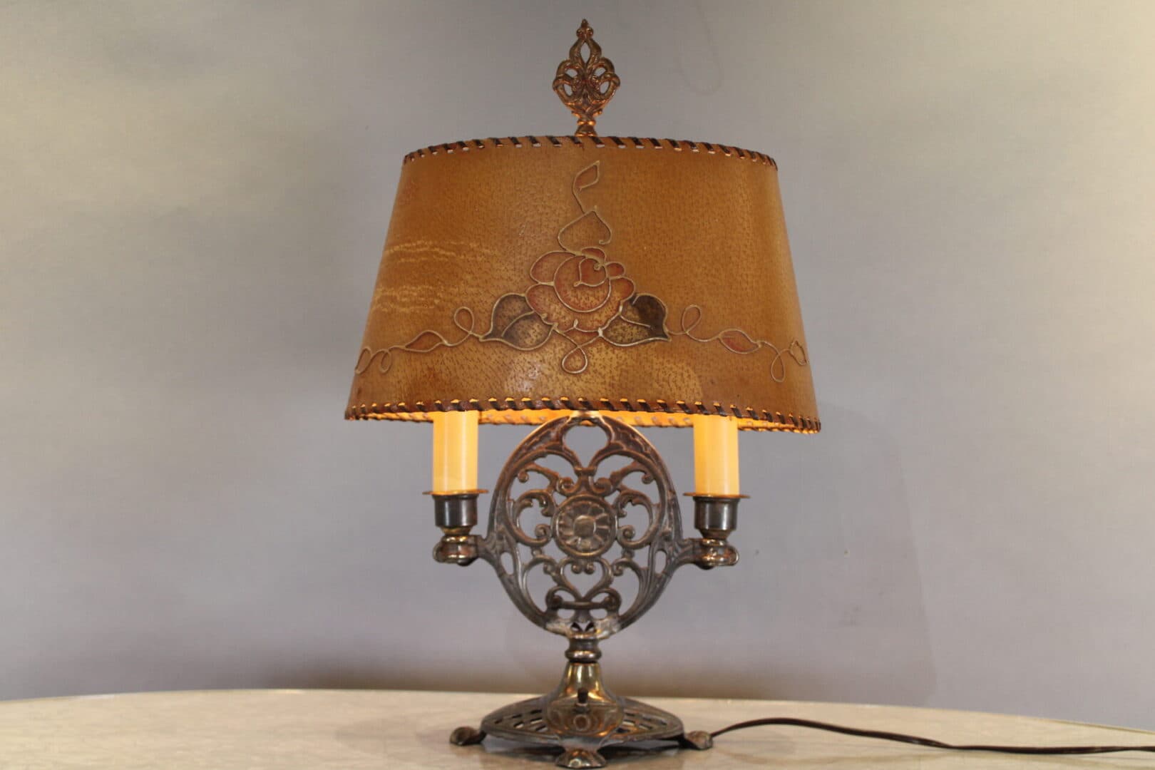 Ornate table lamp with decorative lampshade.