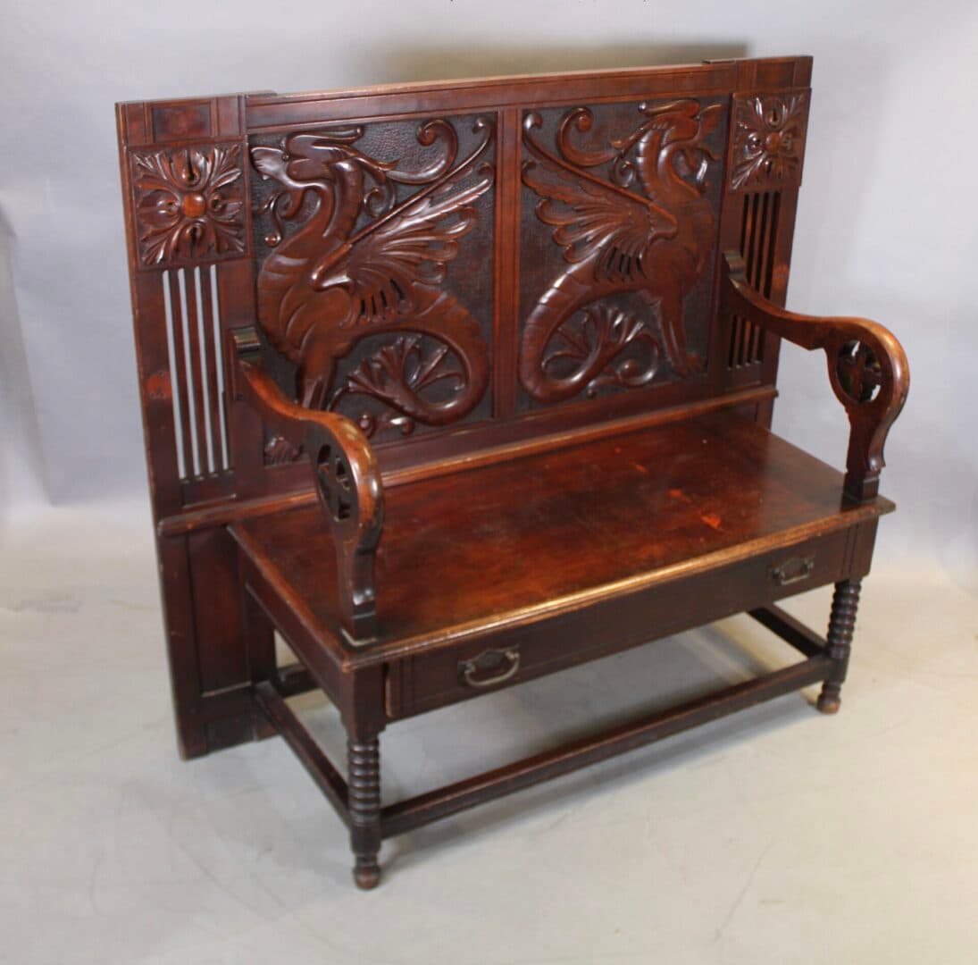 Wooden bench with carved dragon design.