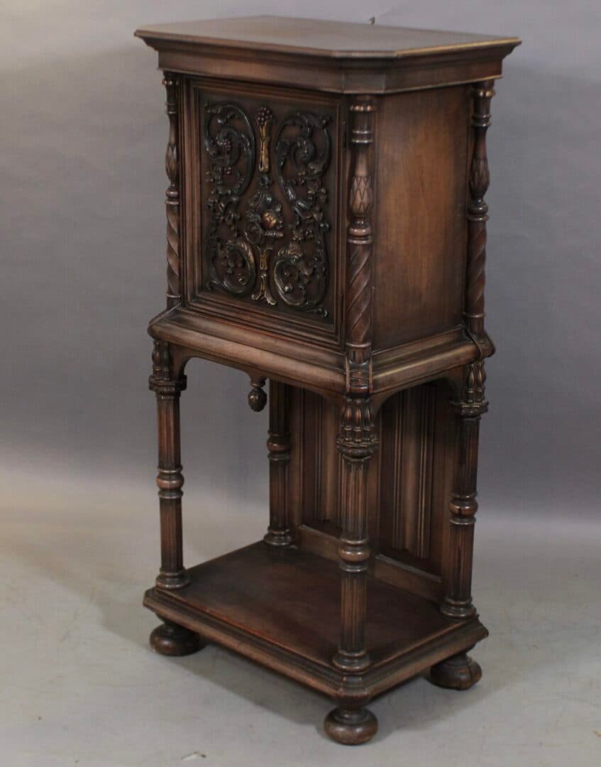 41300. Spanish Revival 1920’s Tall Cabinet With Carved Details