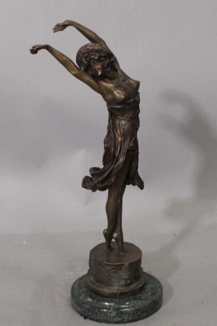 Bronze dancing woman statue on marble base