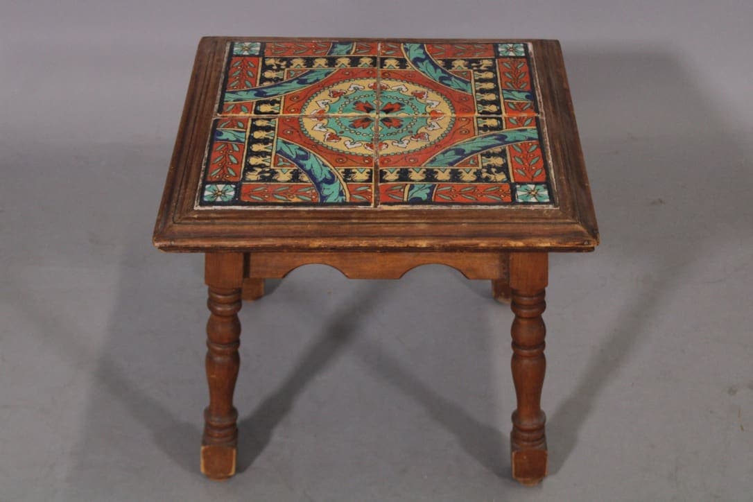 Small wooden table with patterned tile top