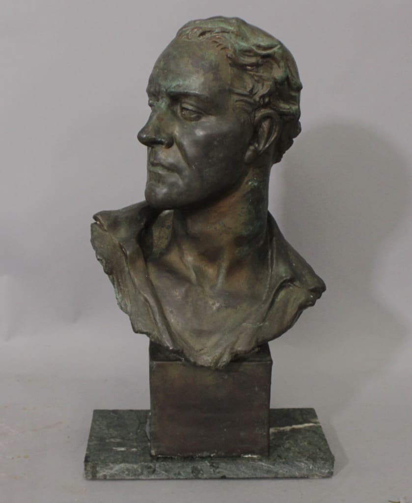 Bronze bust of a man on marble base