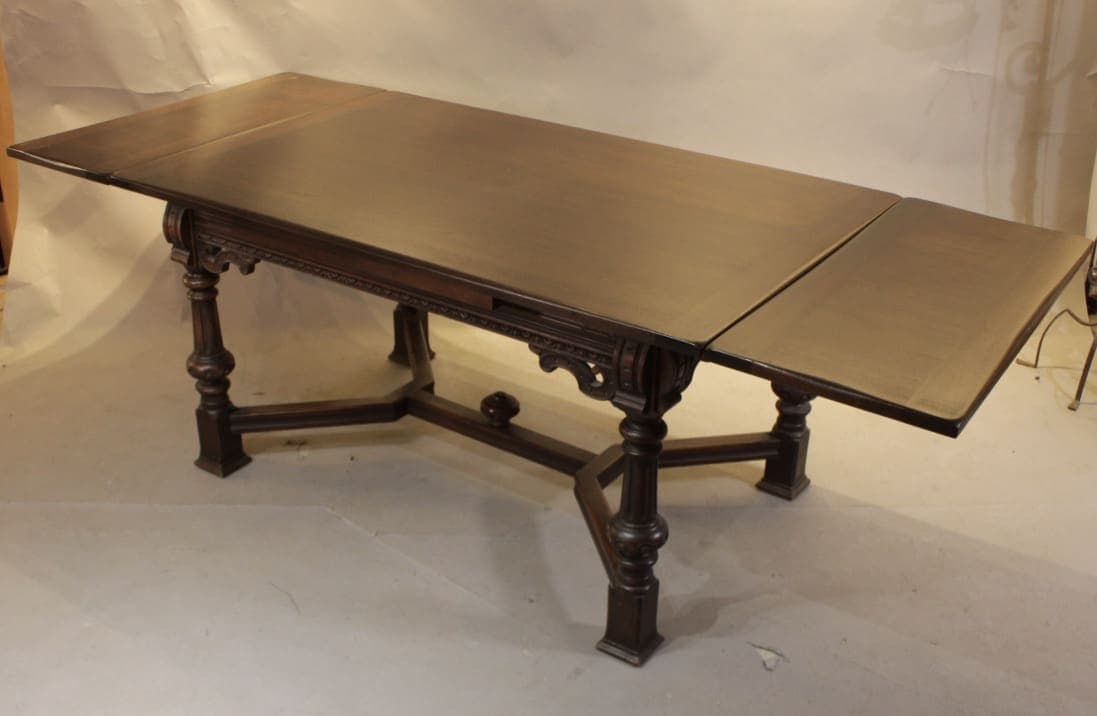 Antique wooden dining table with drop leaves