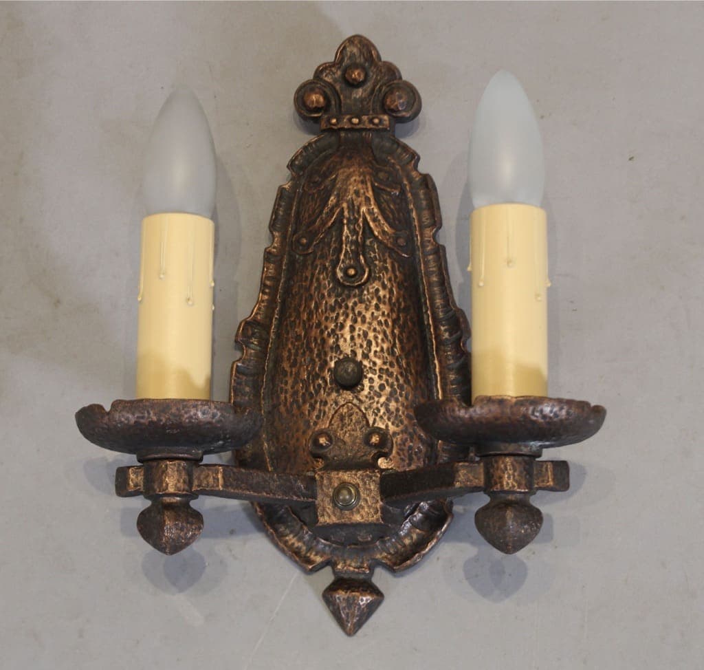 Ornate bronze double candle wall sconce