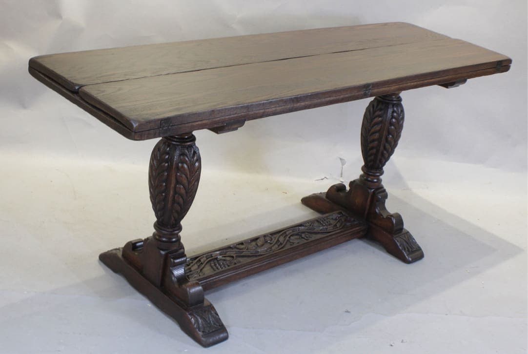 Antique carved wooden pedestal dining table