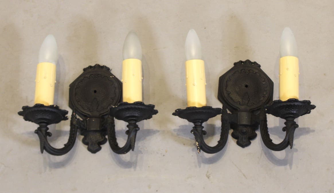 Two black vintage double-arm wall sconces