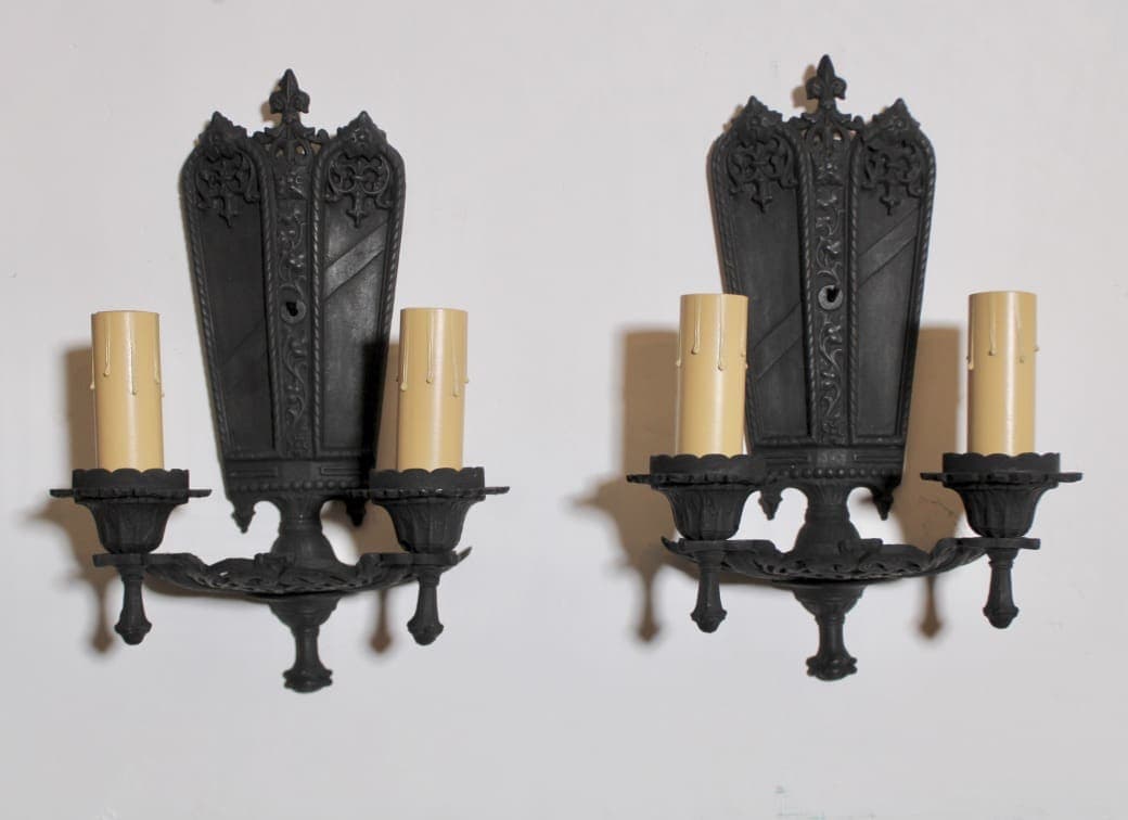 Pair of ornate black wall candle sconces