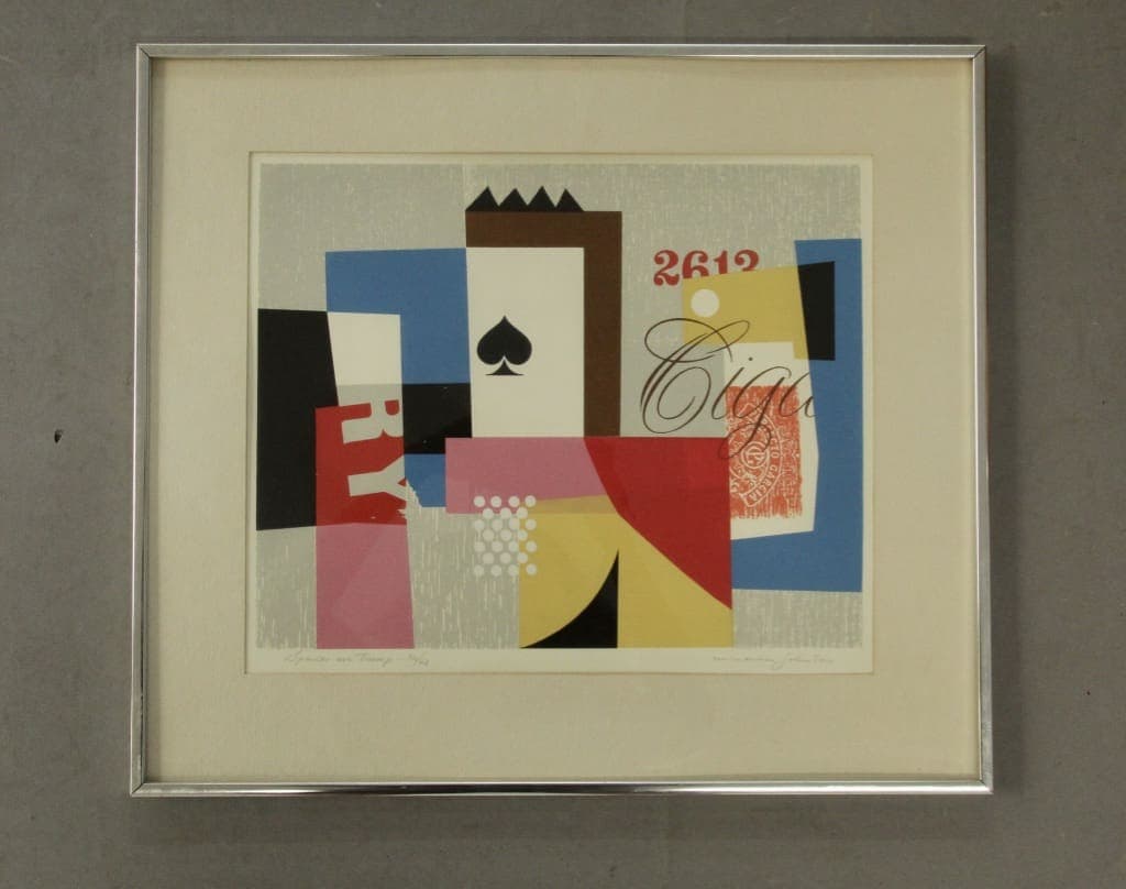 Framed abstract collage featuring playing card spade