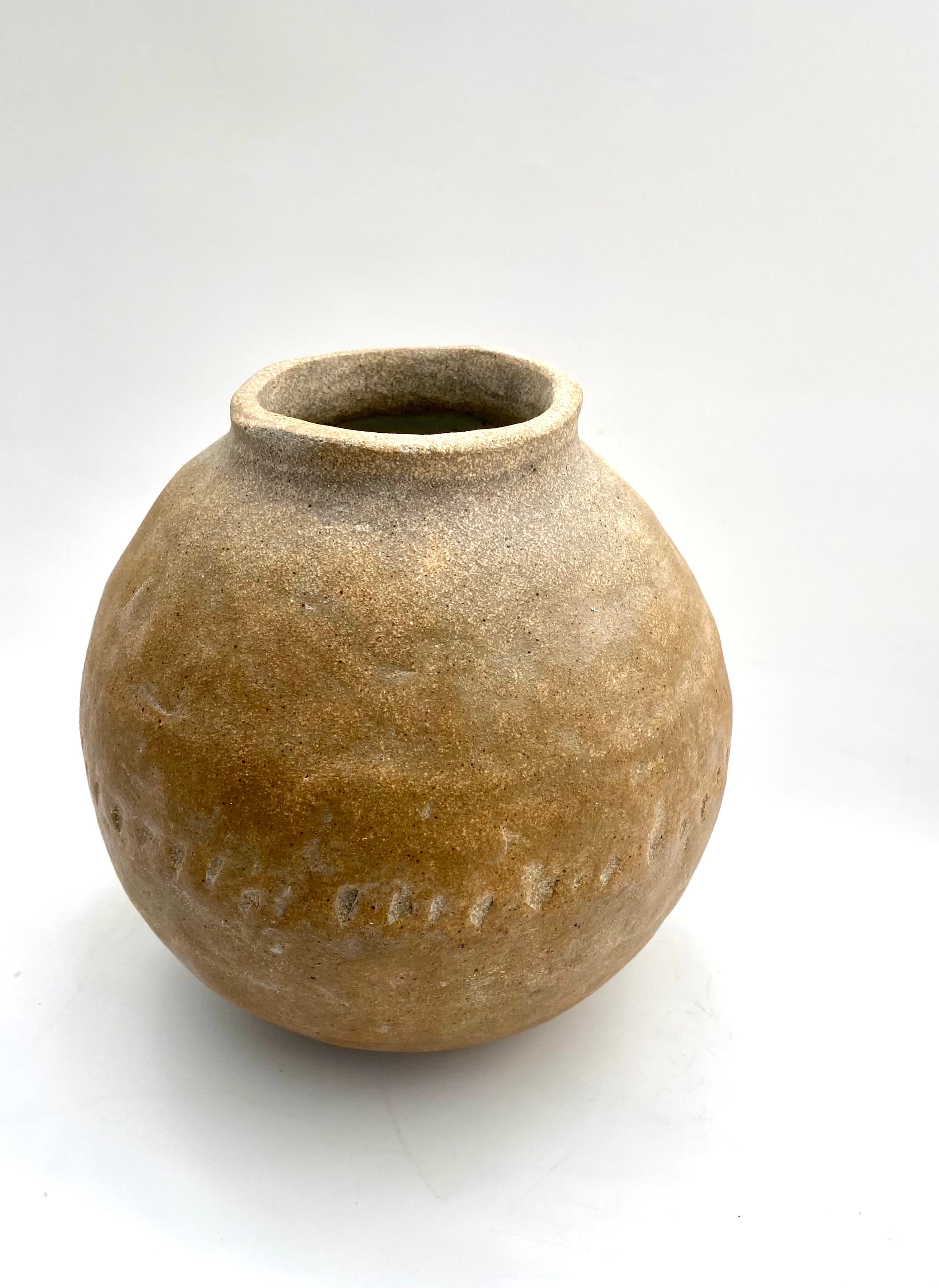 Primitive pockmarked vessel