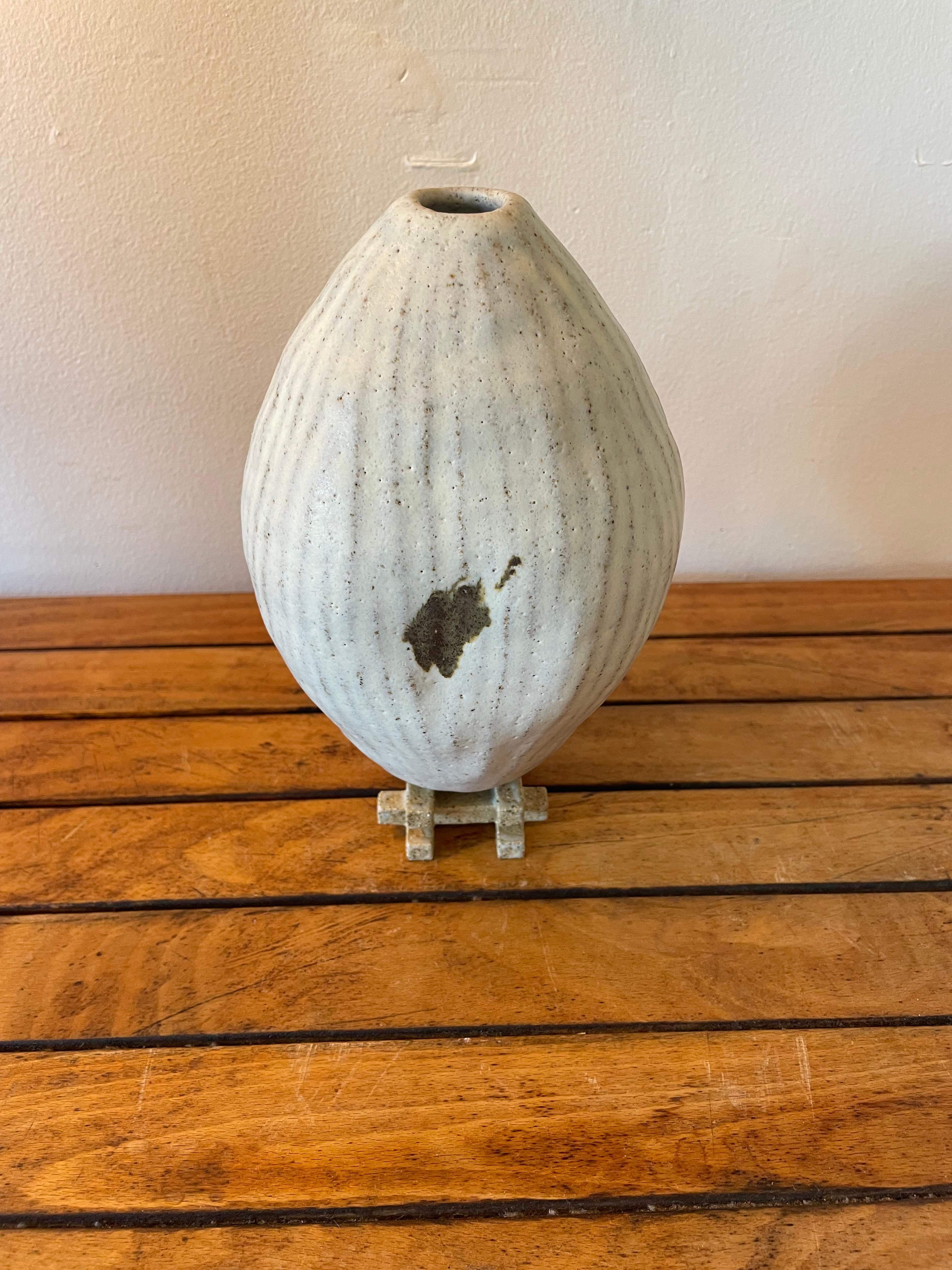 Large vessel w/iron oxide on jenga base by Ren Ceramics
