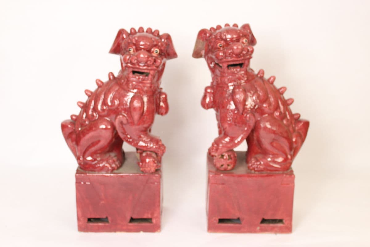 Large pair of glazed earthenware foo dogs