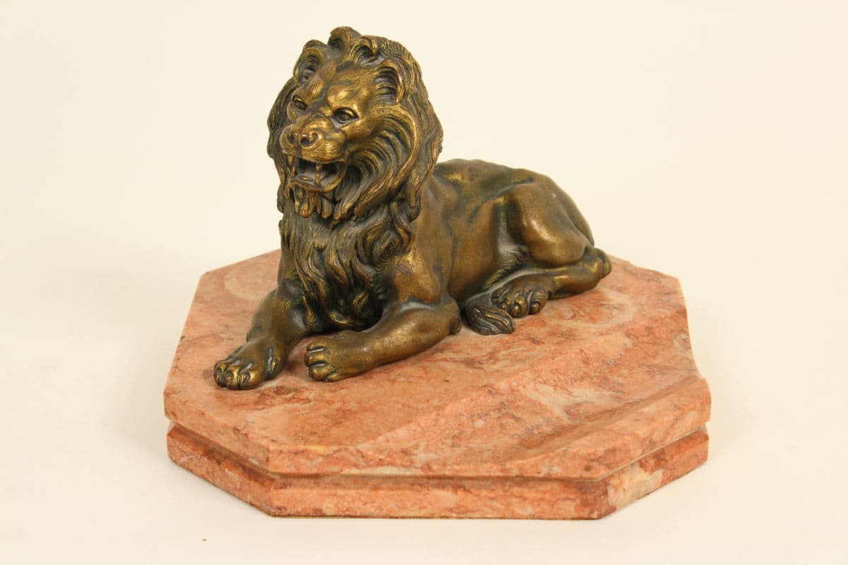 Bronze lion form inkwell on a marble base