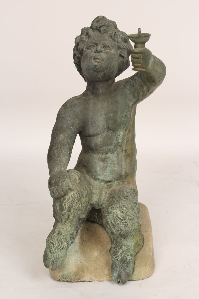 Bronze garden statue of an infant satyr