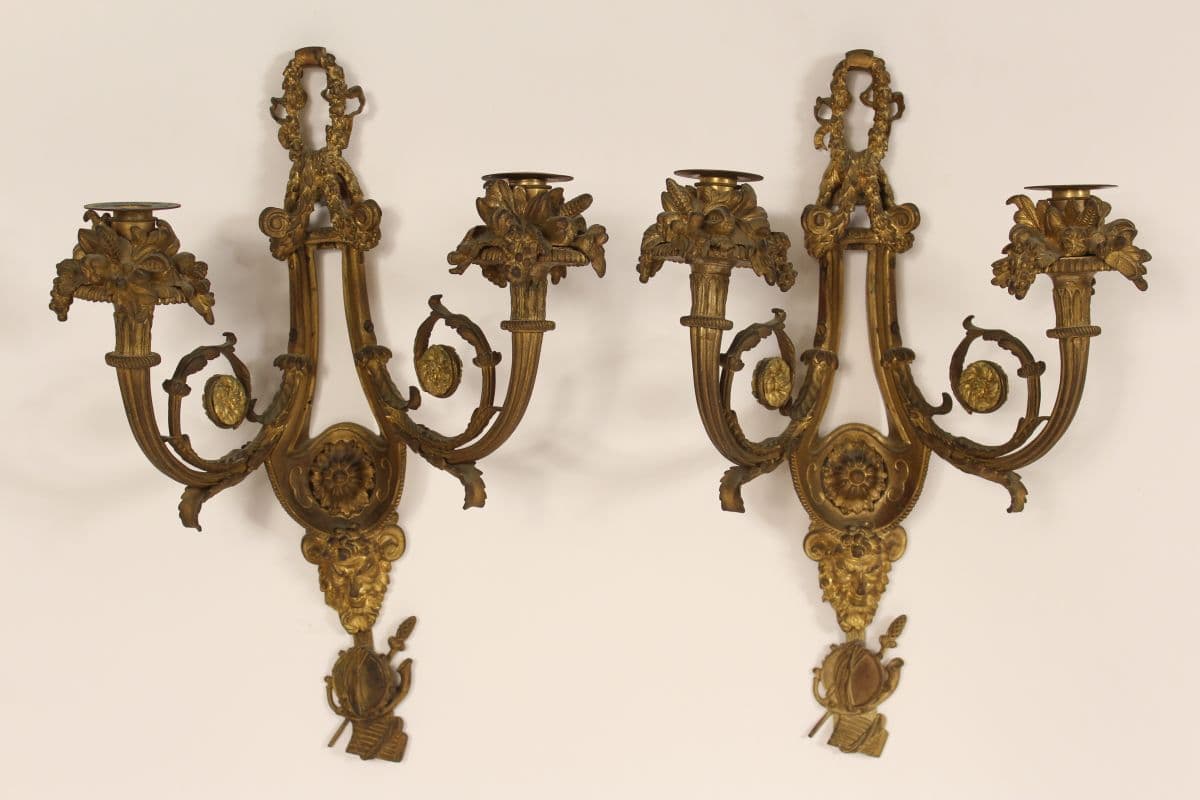 Pair of antique Louis XVI style gilt bronze wall sconces