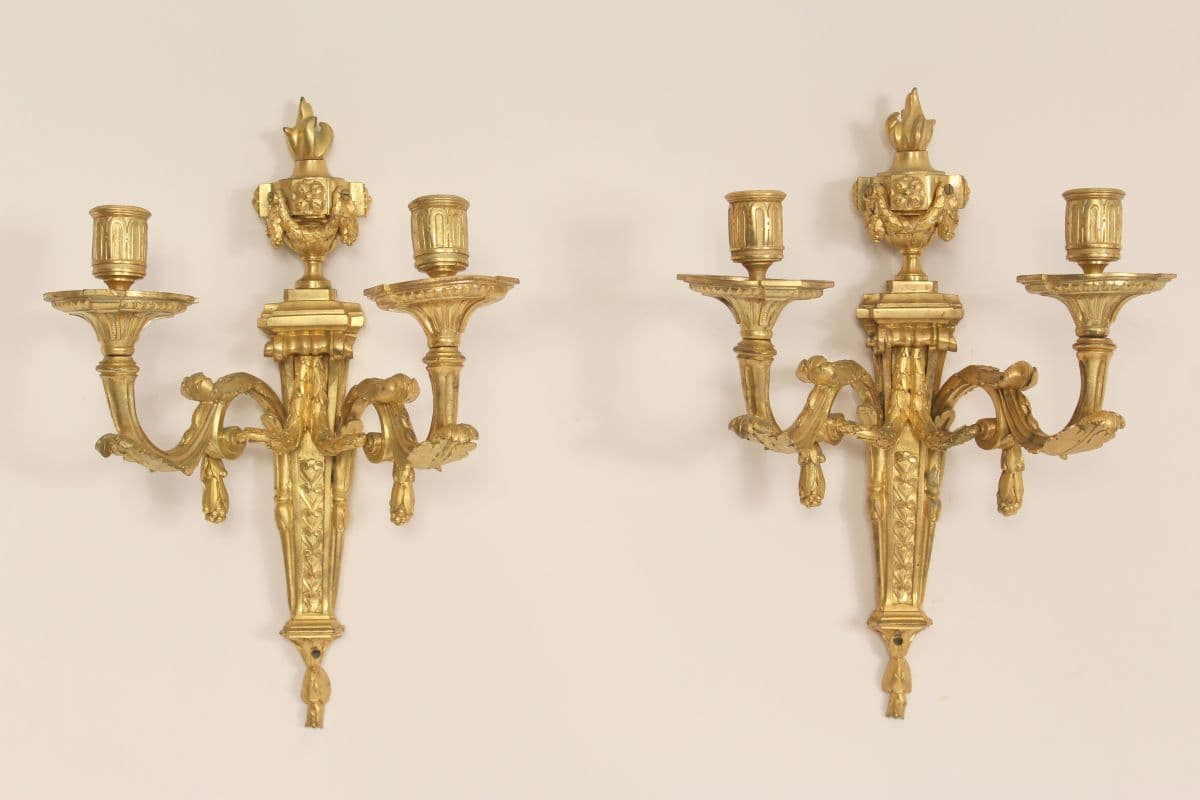 Pair of antique Louis XVI style gilt bronze wall sconces