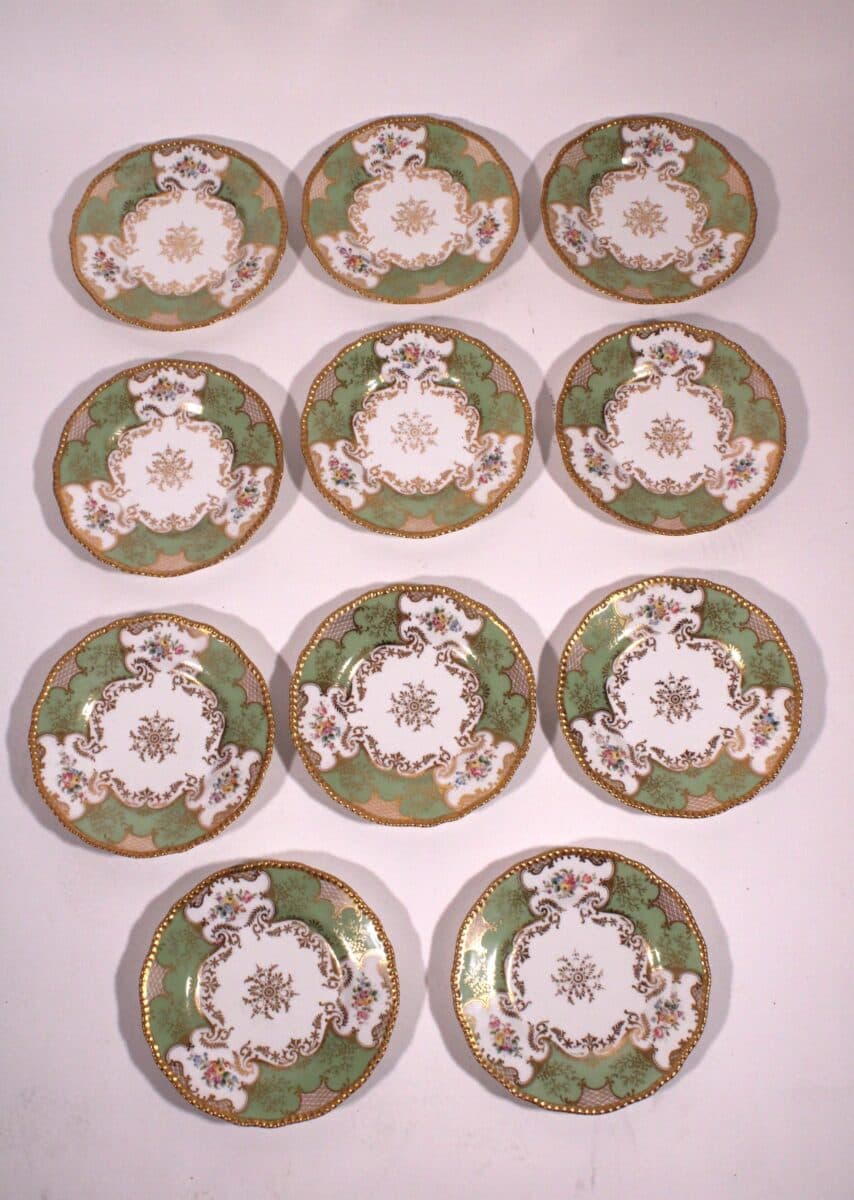 Set of 11 Delinieres & Co. Limoges 9.5″ Diameter Plates.