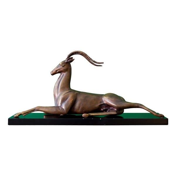 Sold - Brass Reclining Impala Sculpture on Black Lacquered Base - Rubbish Interiors Inc.