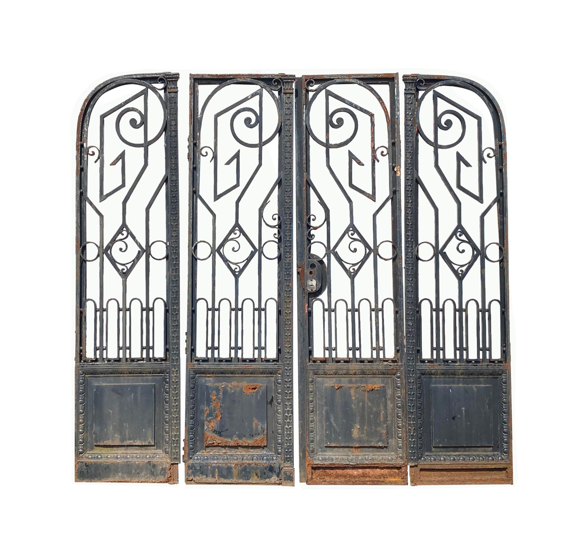 Art Nouveau wrought iron bifold doors with decorative scrollwork, four panels, and lower solid sections shown front view.